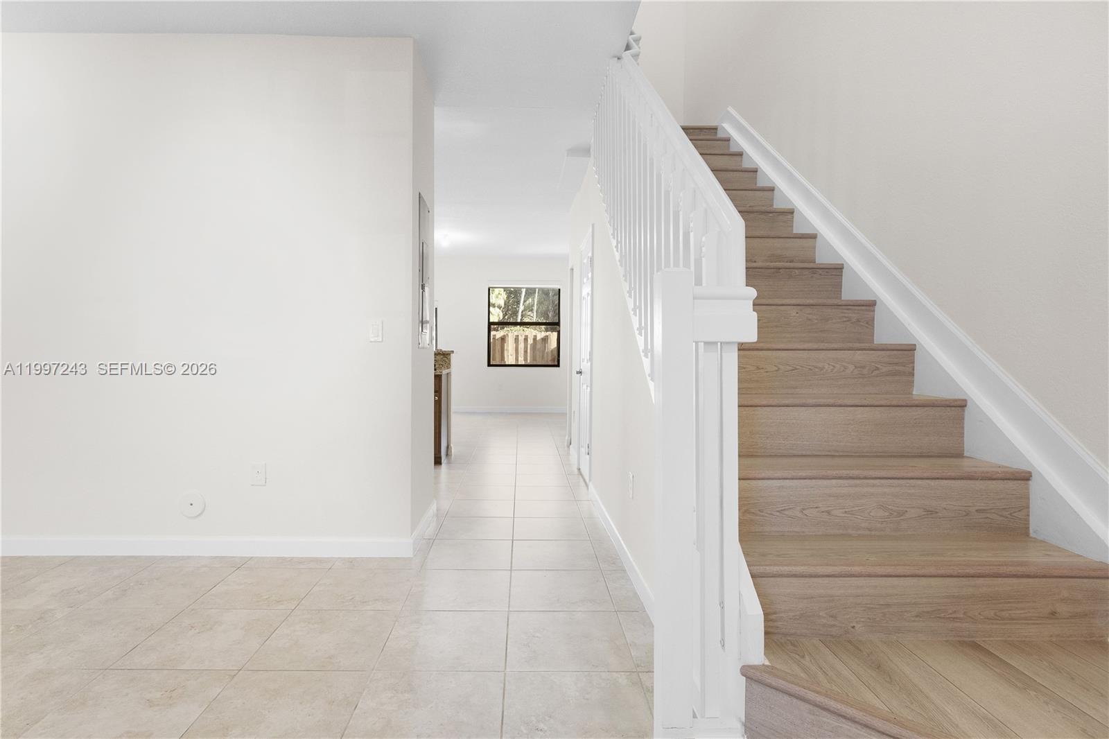 15075 Southwest 113th Terrace Miami, FL 33196 - Photo 7 of 36 a view of a hallway with staircase