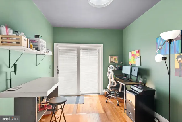 a bathroom with a granite countertop sink and a bathtub
