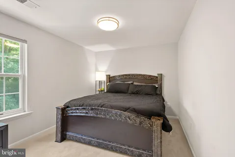 a room with gym equipment and a large window