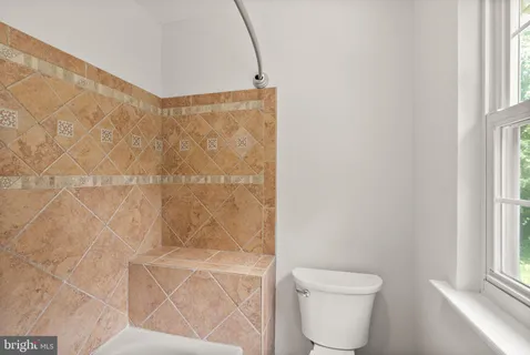 a view of a house with a yard and plants