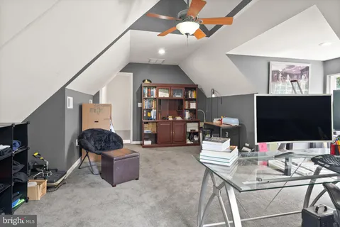a view of roof deck with couches and wooden floor