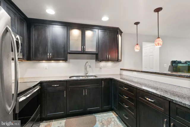 a roof deck with a table and chairs