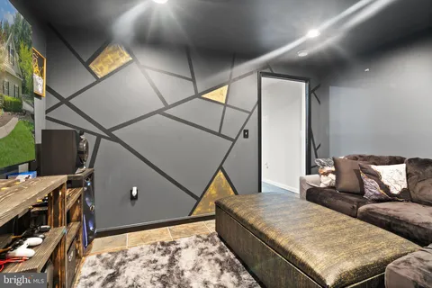 an aerial view of a house with a yard swimming pool outdoor seating and yard