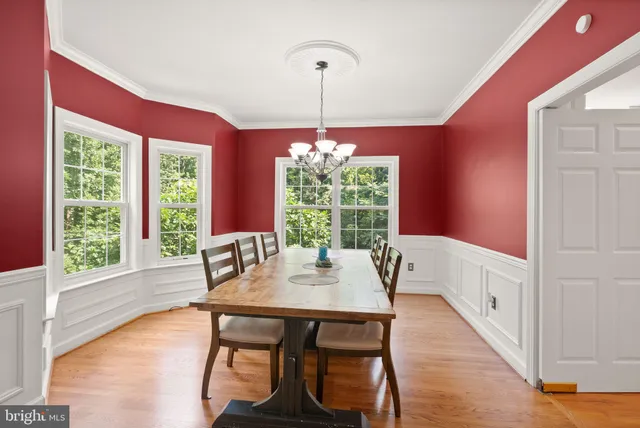a kitchen with stainless steel appliances granite countertop a stove refrigerator sink and cabinets