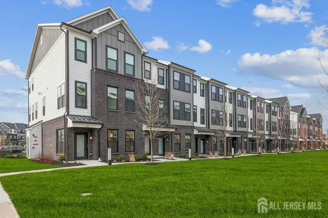 a large building with a yard in front of it