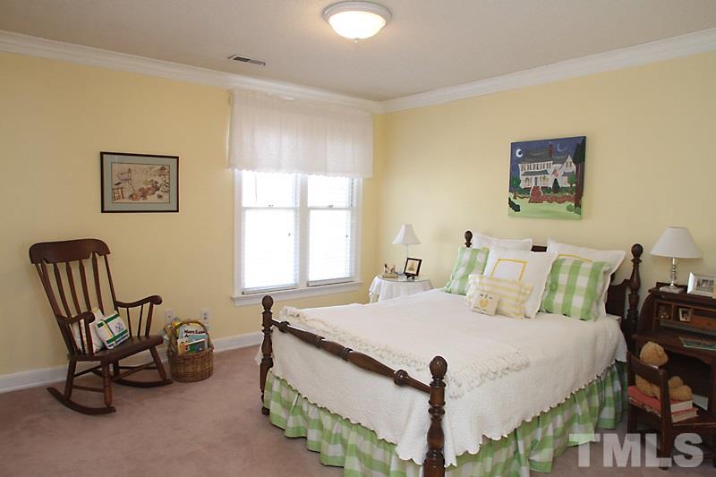 2007 Landings Way Raleigh, NC 27615 - Photo 11 of 17 a bedroom with a bed and a chair