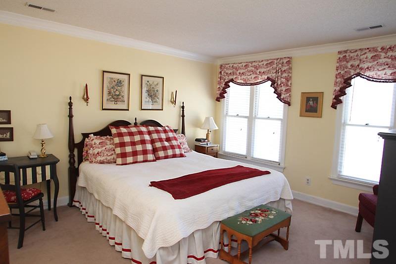 2007 Landings Way Raleigh, NC 27615 - Photo 12 of 17 a bedroom with a bed and a window