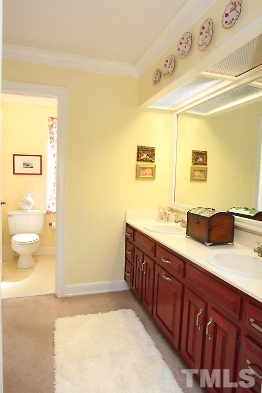2007 Landings Way Raleigh, NC 27615 - Photo 13 of 17 a spacious bathroom with a granite countertop sink and a mirror