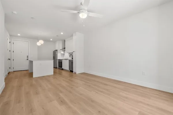 a view of a kitchen with a sink and a microwave