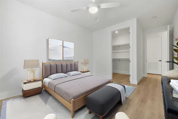 a bedroom with a bed and a couch