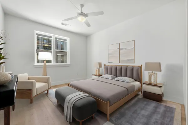 a bedroom with a bed and a window