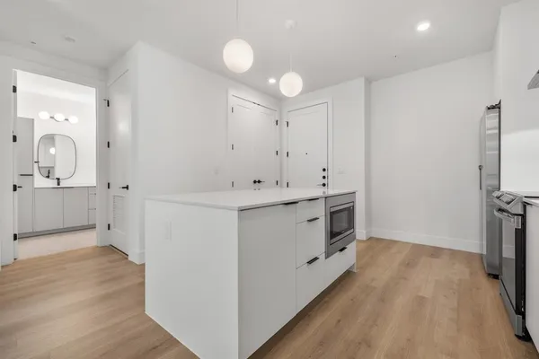 a bathroom with a sink a mirror and a shower