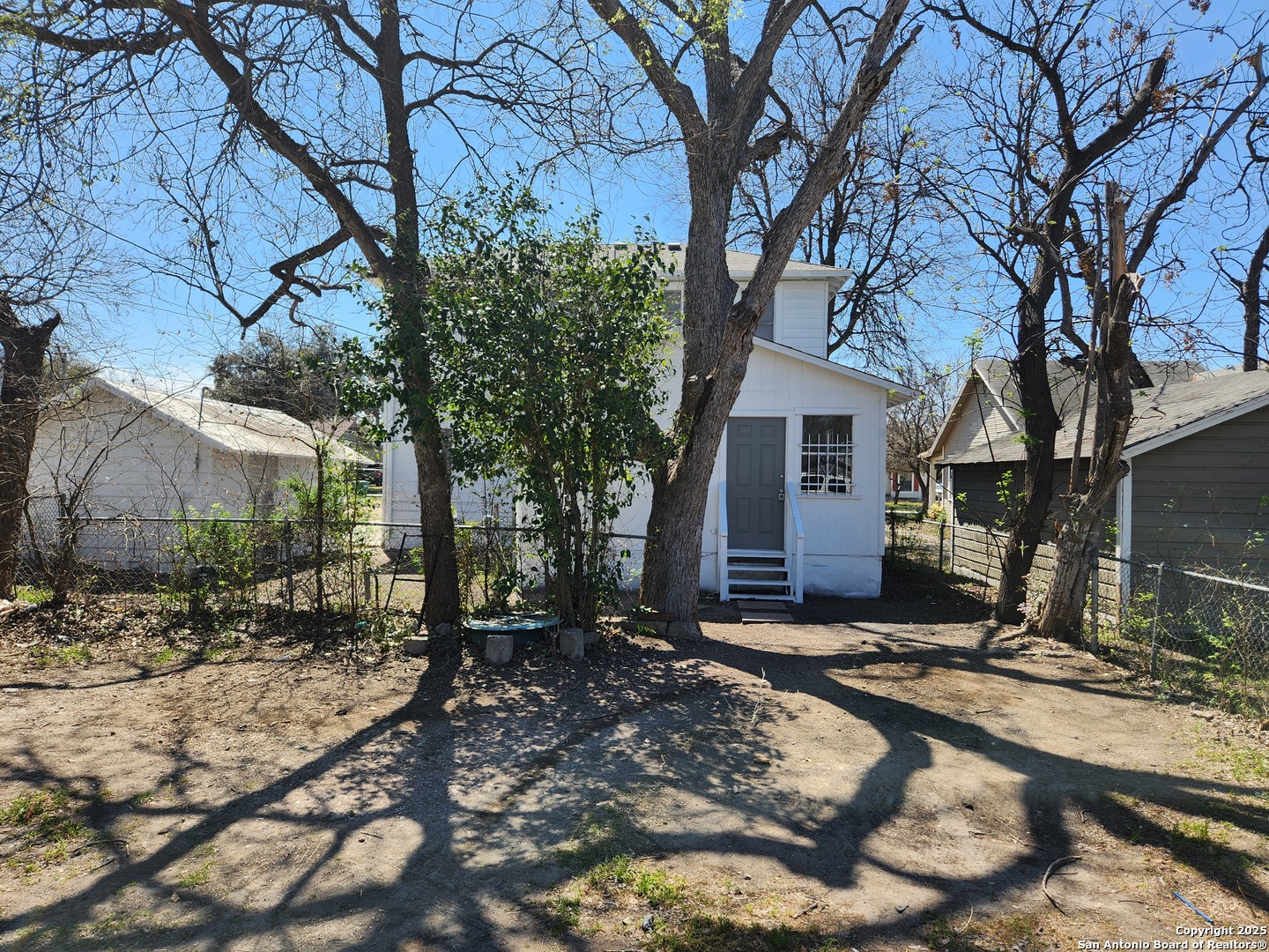 519 Topeka Boulevard, Unit 3 San Antonio, TX 78210 - Photo 1 of 7 a view of a house with a yard covered in snow