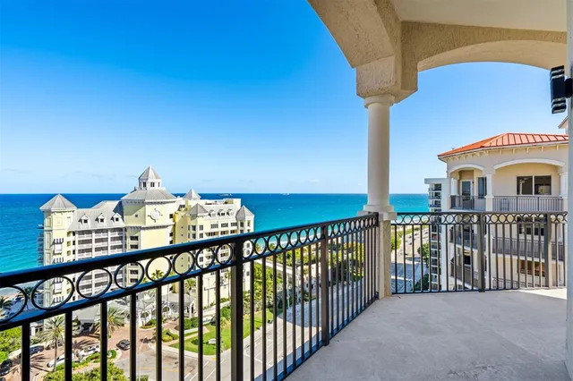 a view of a balcony with an ocean view