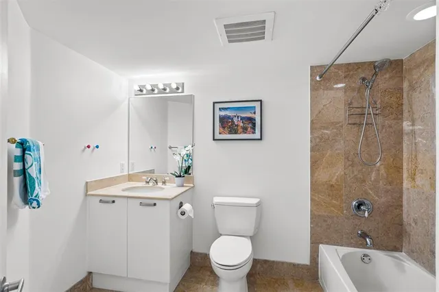 a bedroom with bed and a window