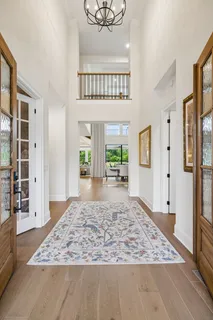 a dining room with furniture a fireplace and wooden floor