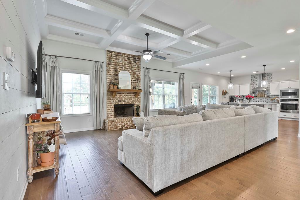 169 Hart Ridge Court Fortson, GA 31808 - Photo 13 of 50 a living room with furniture and a fireplace