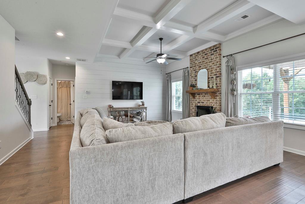 169 Hart Ridge Court Fortson, GA 31808 - Photo 16 of 50 a living room with furniture a fireplace and a flat screen tv