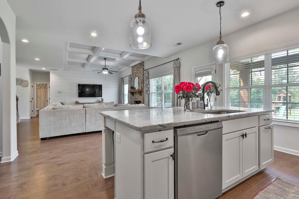 169 Hart Ridge Court Fortson, GA 31808 - Photo 24 of 50 a kitchen with granite countertop a sink cabinets and window
