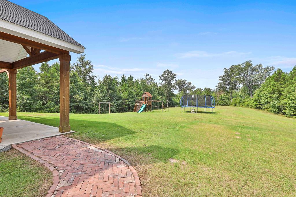 169 Hart Ridge Court Fortson, GA 31808 - Photo 45 of 50 a view of a yard with palm tree
