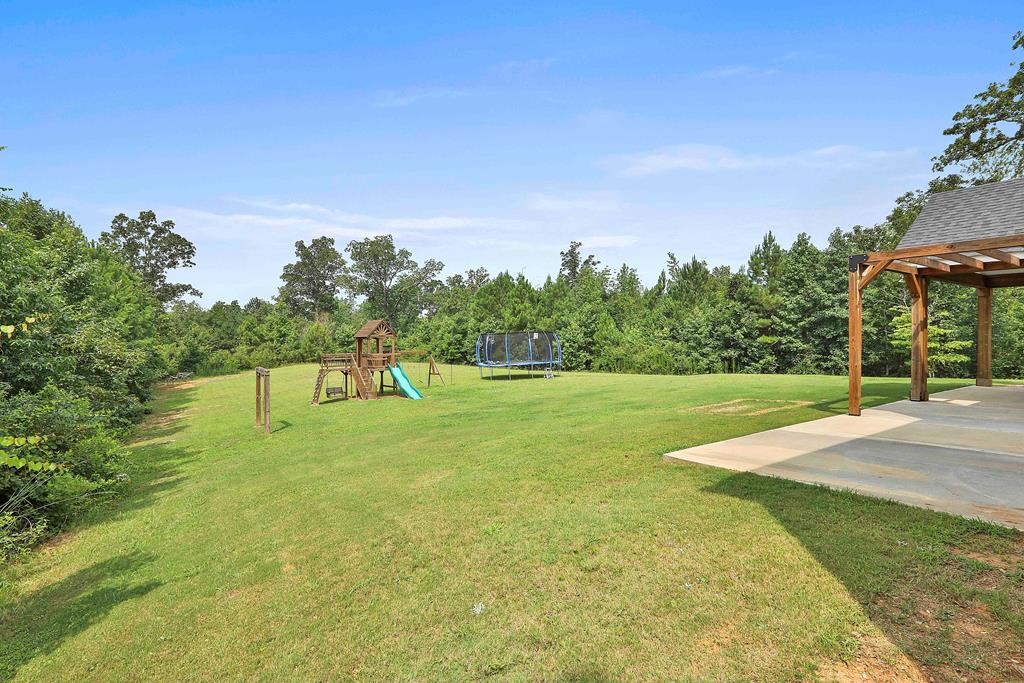 169 Hart Ridge Court Fortson, GA 31808 - Photo 50 of 50 a swimming pool with trees in the background