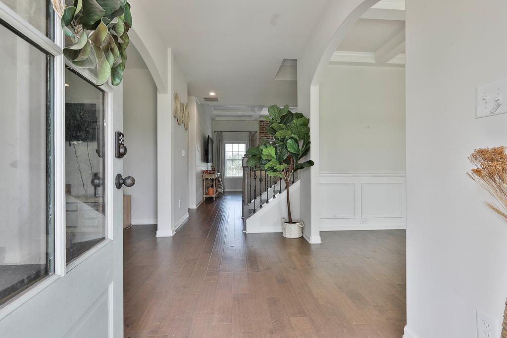 169 Hart Ridge Court Fortson, GA 31808 - Photo 6 of 50 a view of a hallway with wooden floor and a potted plant