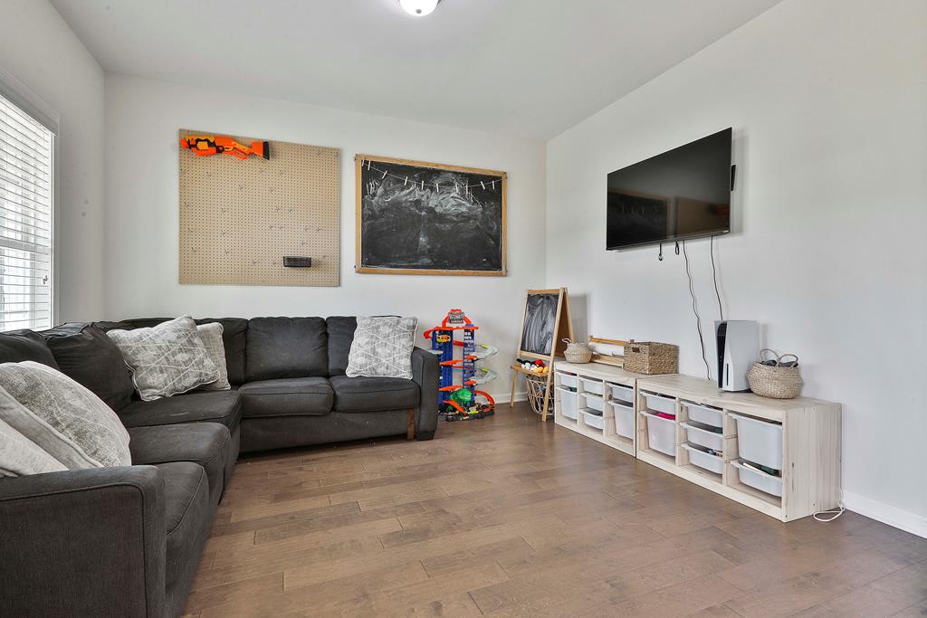 169 Hart Ridge Court Fortson, GA 31808 - Photo 8 of 50 a living room with furniture and a flat screen tv