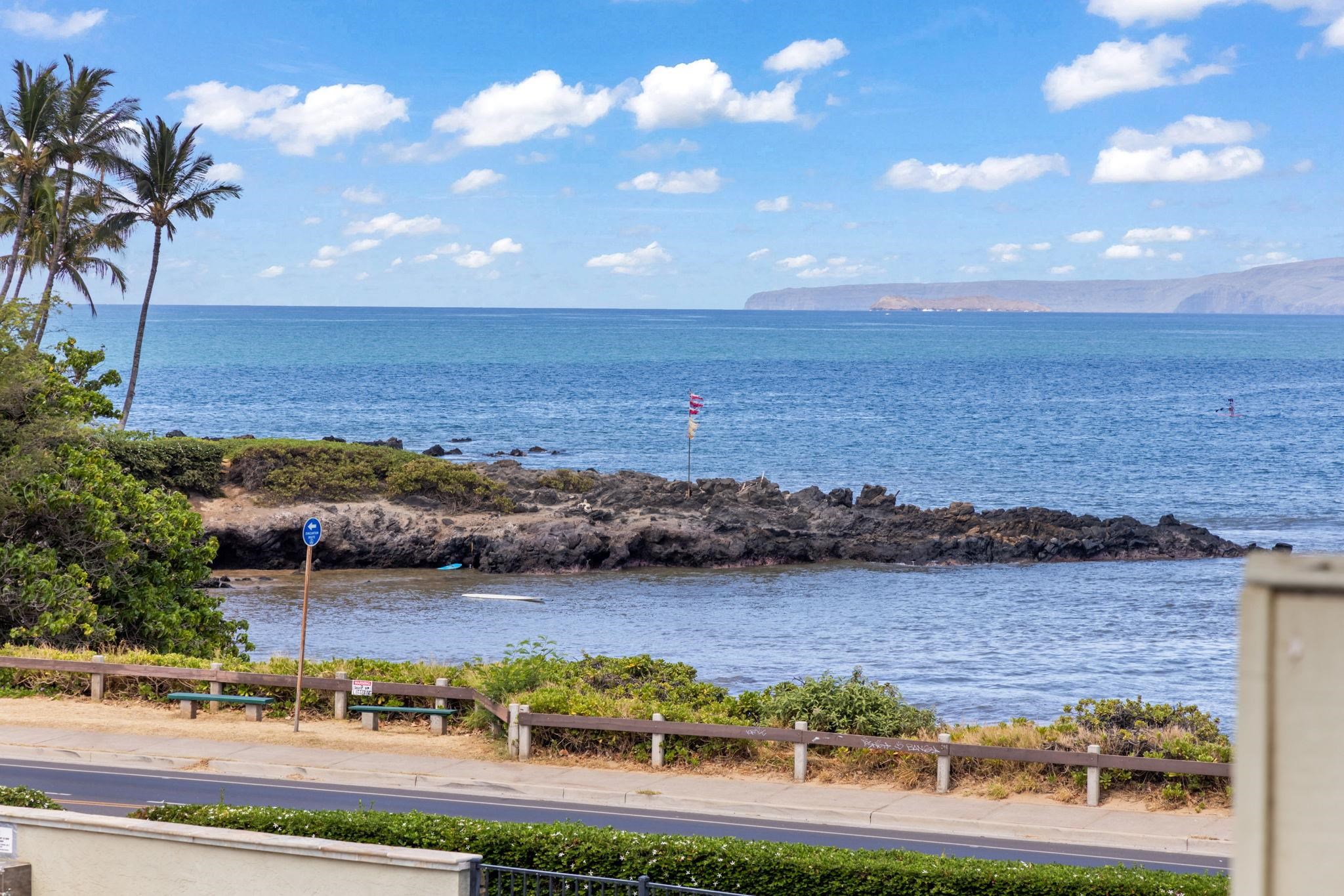 2058 Kanoe Street, Unit 2C Kihei, HI 96753 - Photo 19 of 27 a view of a lake with houses in the back