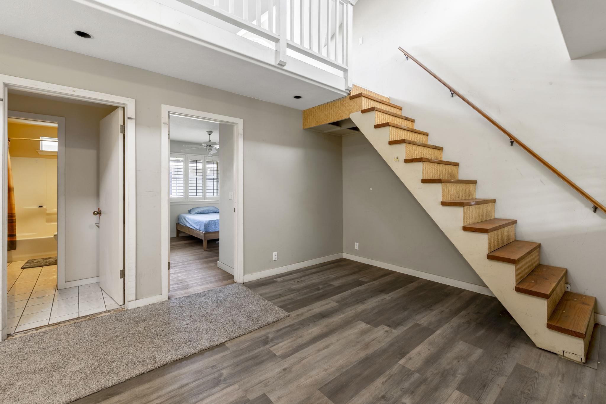 2058 Kanoe Street, Unit 2C Kihei, HI 96753 - Photo 9 of 27 a view of entryway and hall with wooden floor