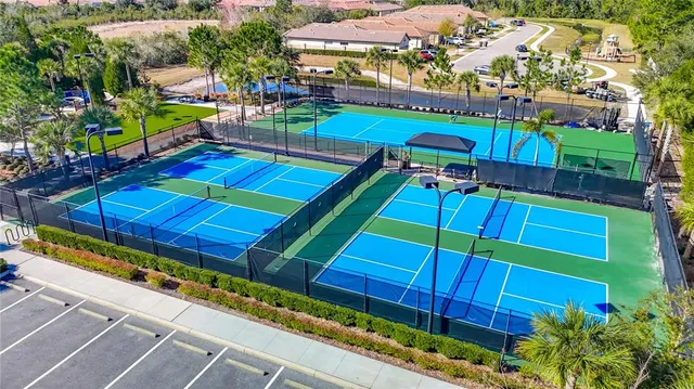an aerial view of a house with a swimming pool and outdoor seating