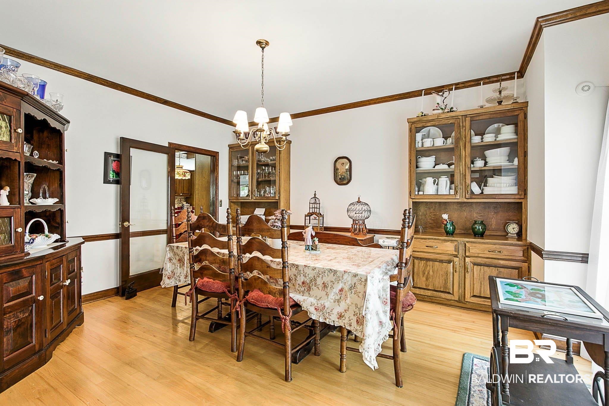17270 Davis Road Summerdale, AL 36580 - Photo 29 of 97 Dining area with a chandelier, ornamental molding, and light wood-type flooring