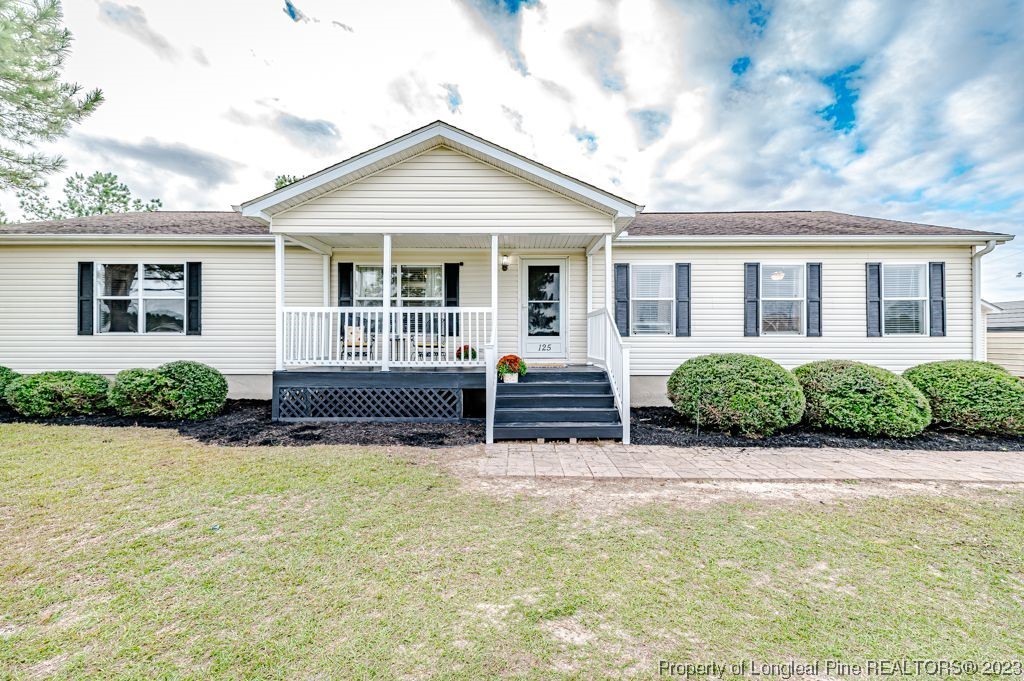 front view of a house with a yard