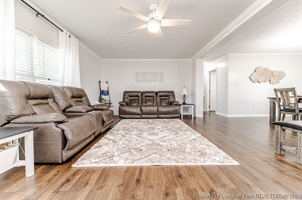 125 Wright Road Vass, NC 28394 - Photo 12 of 48 a living room with furniture and a wooden floor