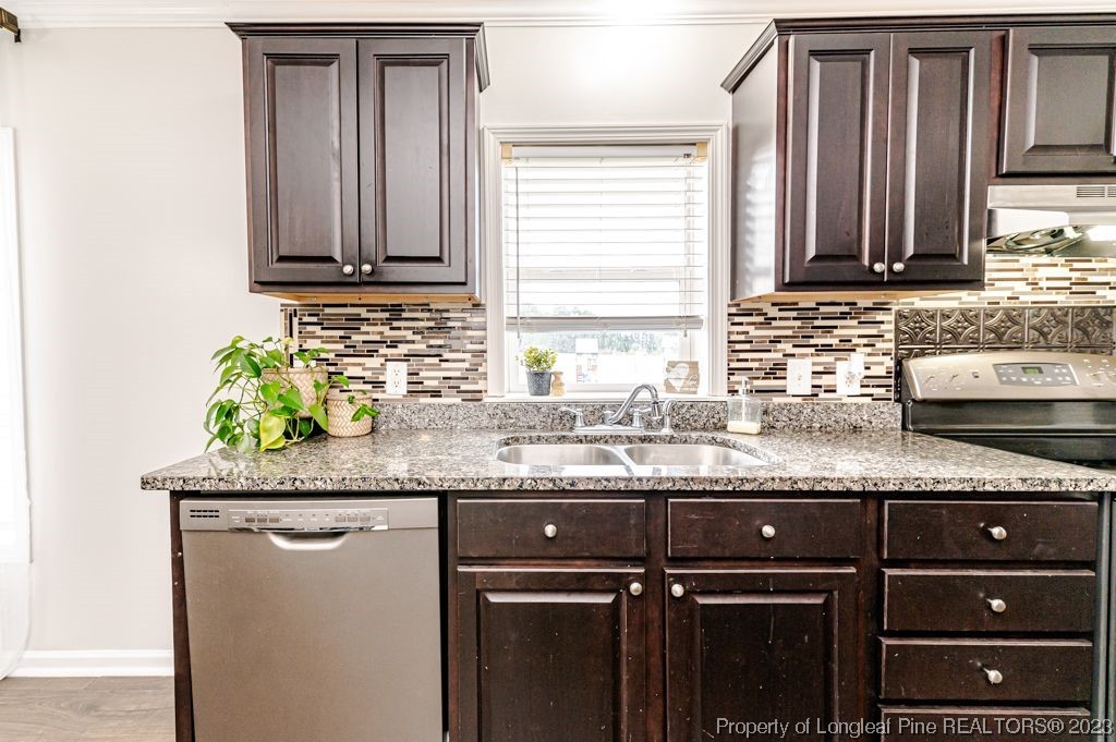 125 Wright Road Vass, NC 28394 - Photo 16 of 48 a kitchen with granite countertop a sink and a granite counter tops