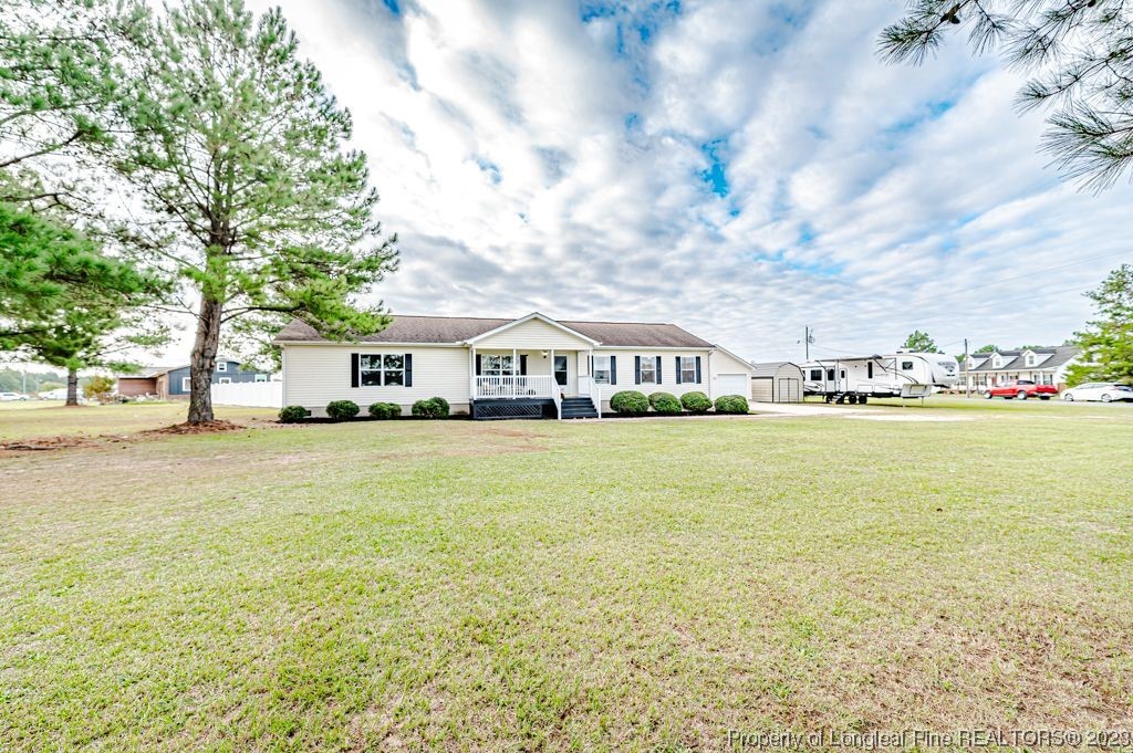 125 Wright Road Vass, NC 28394 - Photo 2 of 48 a front view of house with yard and lake view
