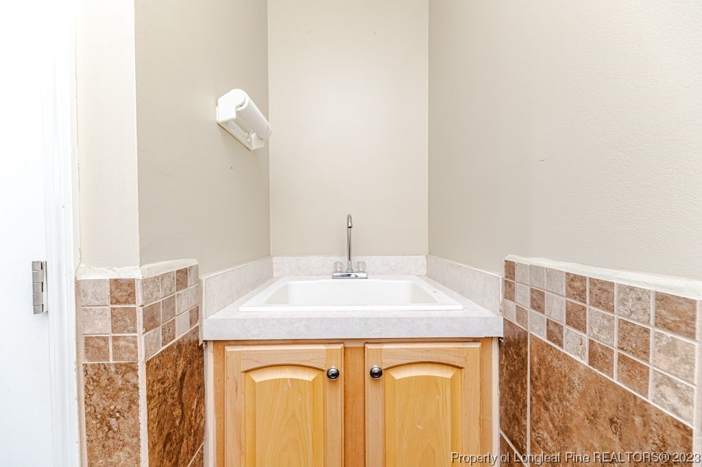 125 Wright Road Vass, NC 28394 - Photo 22 of 48 a kitchen with a sink and a mirror