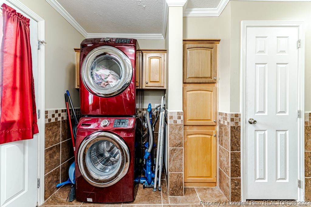 125 Wright Road Vass, NC 28394 - Photo 23 of 48 a view of a storage and utility room with dryer and washer