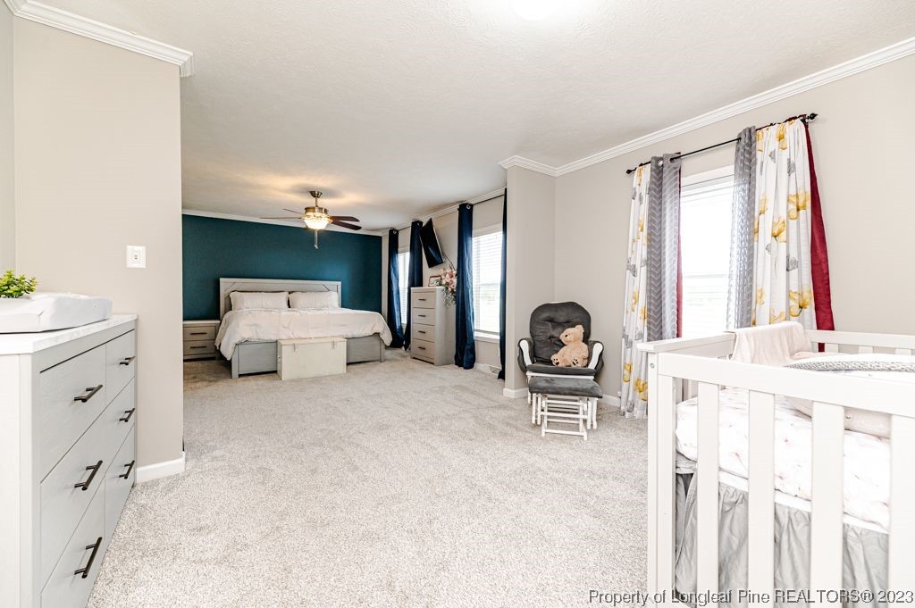 125 Wright Road Vass, NC 28394 - Photo 24 of 48 a living room with furniture and window