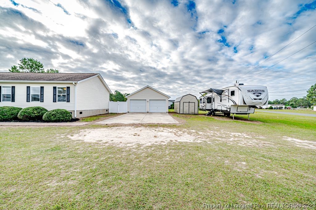 125 Wright Road Vass, NC 28394 - Photo 3 of 48 a view of a house with swimming pool and sitting area