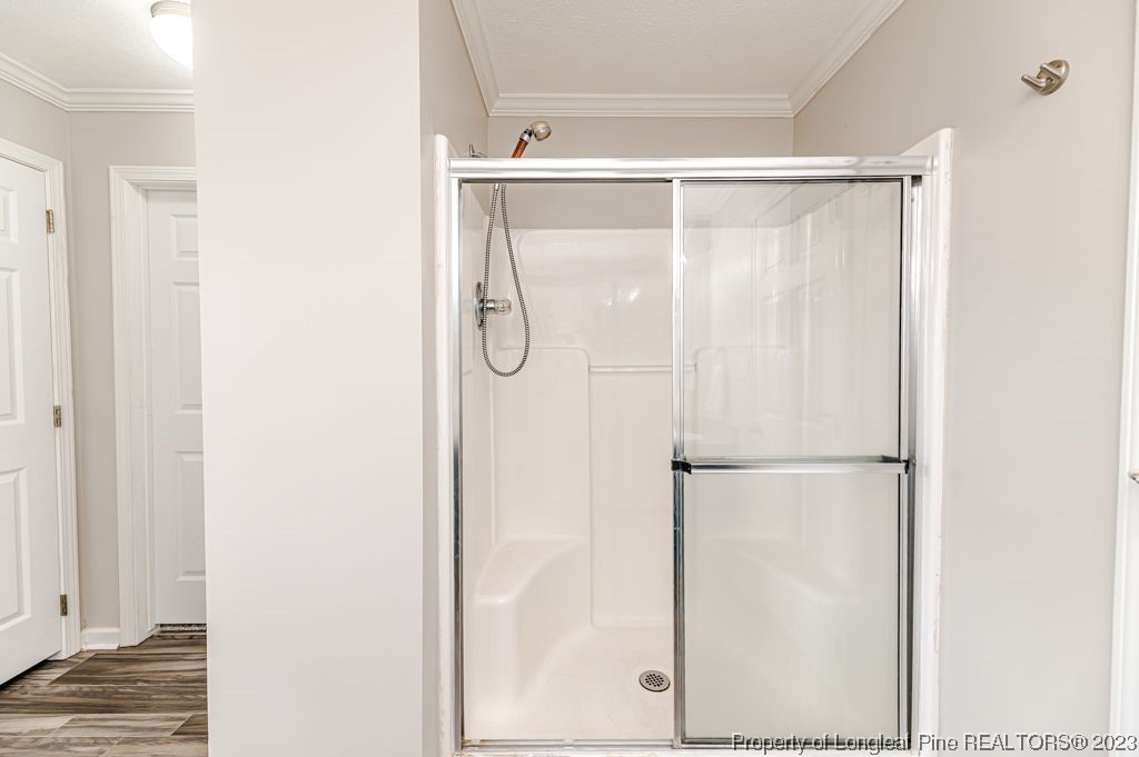 125 Wright Road Vass, NC 28394 - Photo 33 of 48 a bathroom with a glass shower door