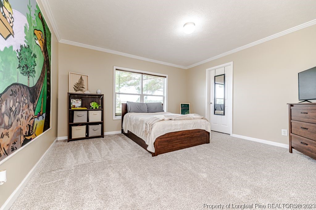 125 Wright Road Vass, NC 28394 - Photo 35 of 48 a bedroom with a bed and a window