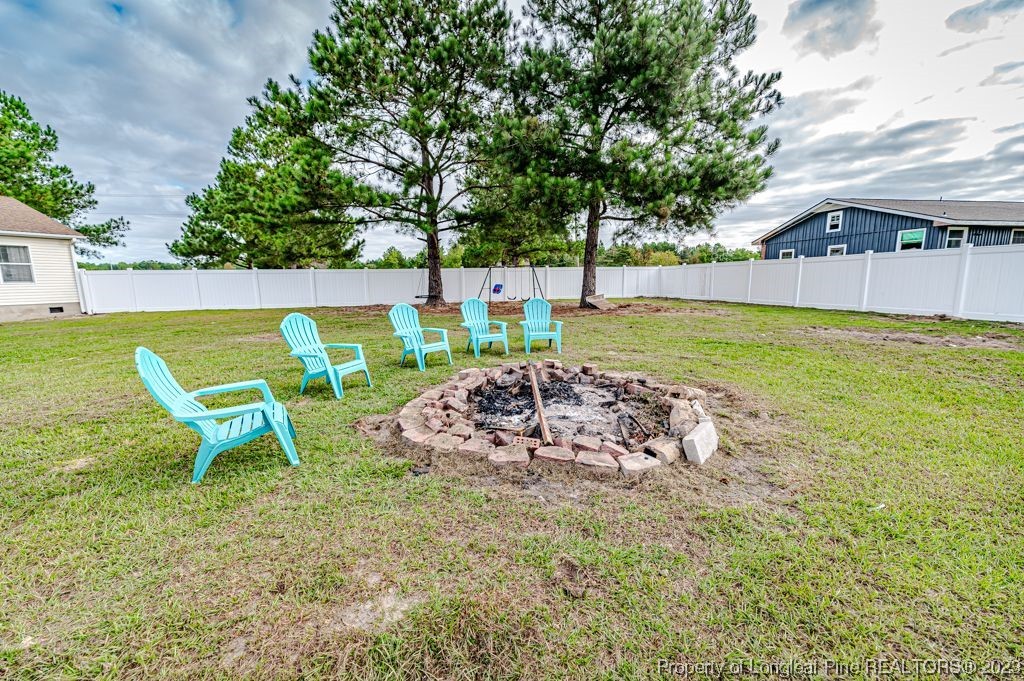 125 Wright Road Vass, NC 28394 - Photo 43 of 48 a view of a swimming pool with a patio and a yard