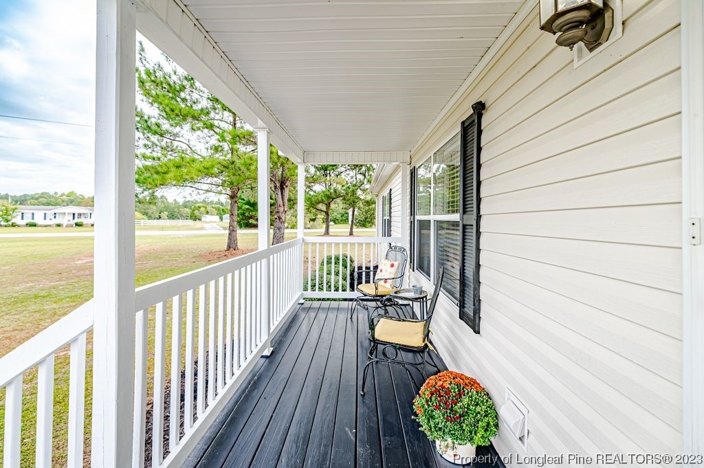 125 Wright Road Vass, NC 28394 - Photo 6 of 48 a view of balcony with wooden floor