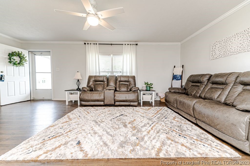 125 Wright Road Vass, NC 28394 - Photo 9 of 48 a living room with furniture window and wooden floor
