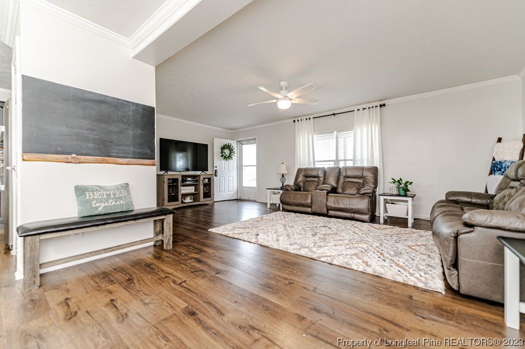 125 Wright Road Vass, NC 28394 - Photo 10 of 48 a living room with furniture window and a flat screen tv