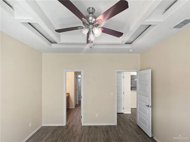 a view of hallway with wooden floor