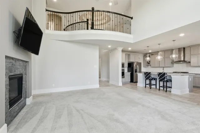 a view of a livingroom with furniture and a flat screen tv