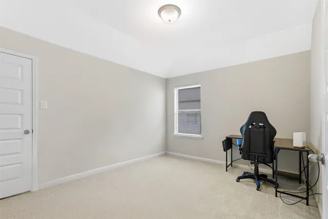 an aerial view of a house with a garden