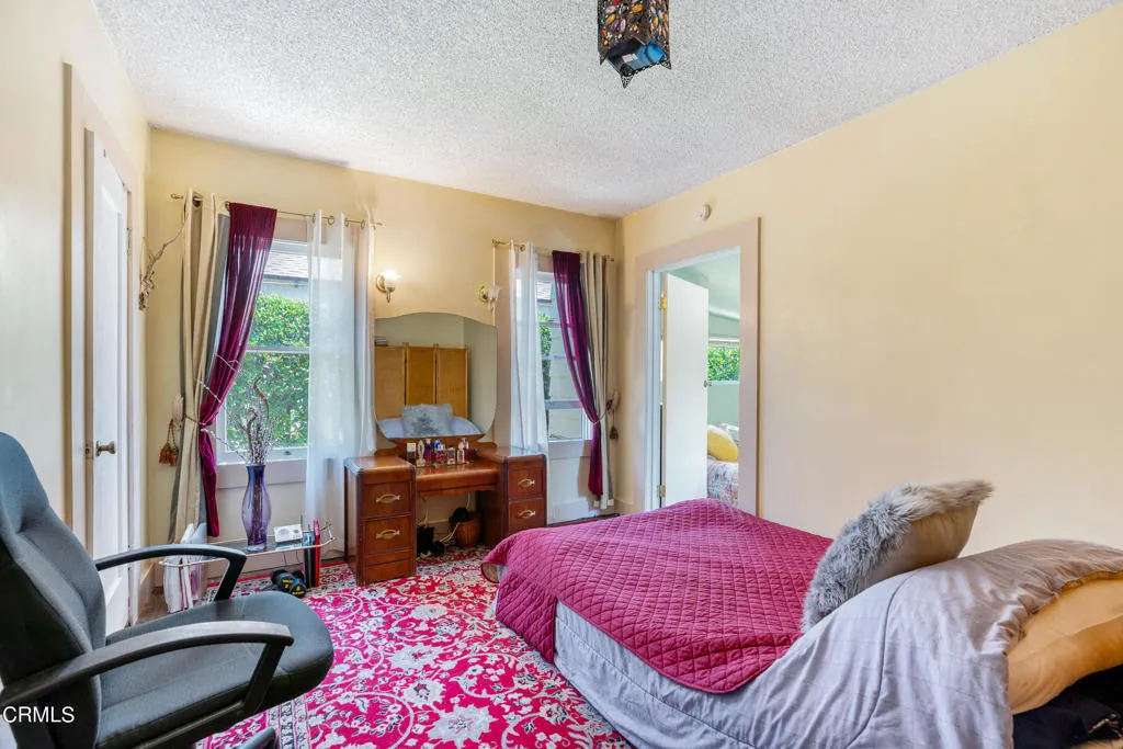 2122 Navarro Avenue Altadena, CA 91001 - Photo 11 of 40 a bedroom with a bed and a couch