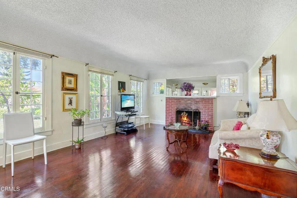 2122 Navarro Avenue Altadena, CA 91001 - Photo 14 of 40 a living room with furniture and a fireplace